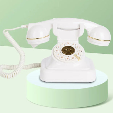 Téléphone fixe vintage fond vert blanc