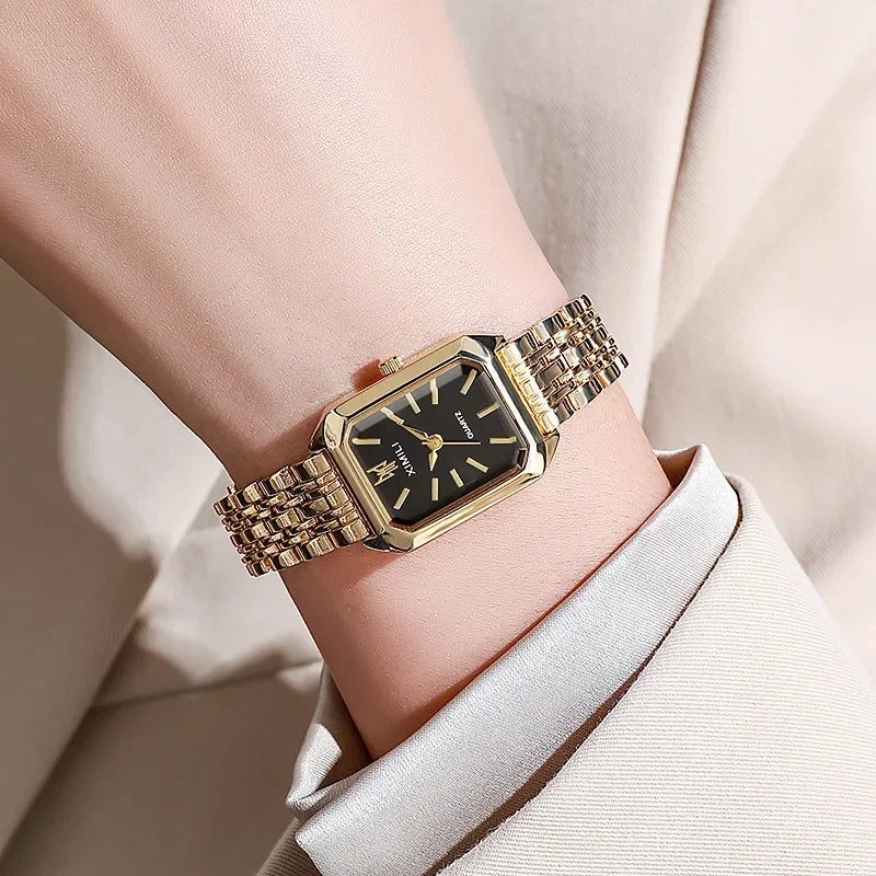 Montre femme vintage noir doré