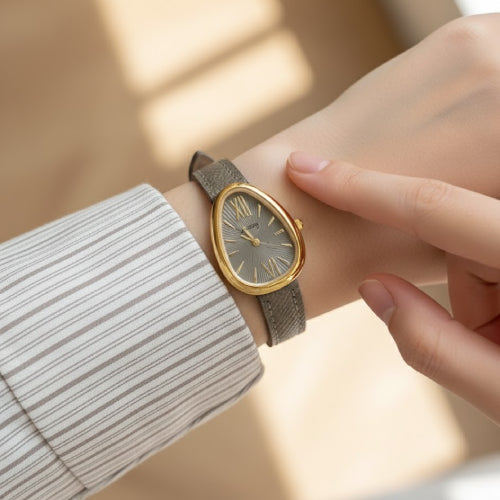 Montre vintage femme ovale gris doré 